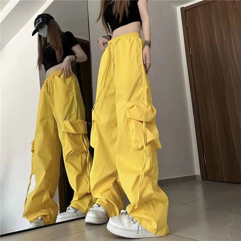 Trendy women’s Y2K cargo pants with oversized pockets, drawstring waist, and a baggy streetwear yellow 2