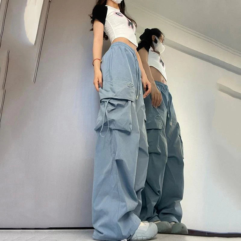 Trendy women’s Y2K cargo pants with oversized pockets, drawstring waist, and a baggy streetwear blue 2