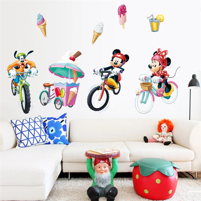 Colorful wall decals of cartoon characters and objects on a white wall above a white couch.