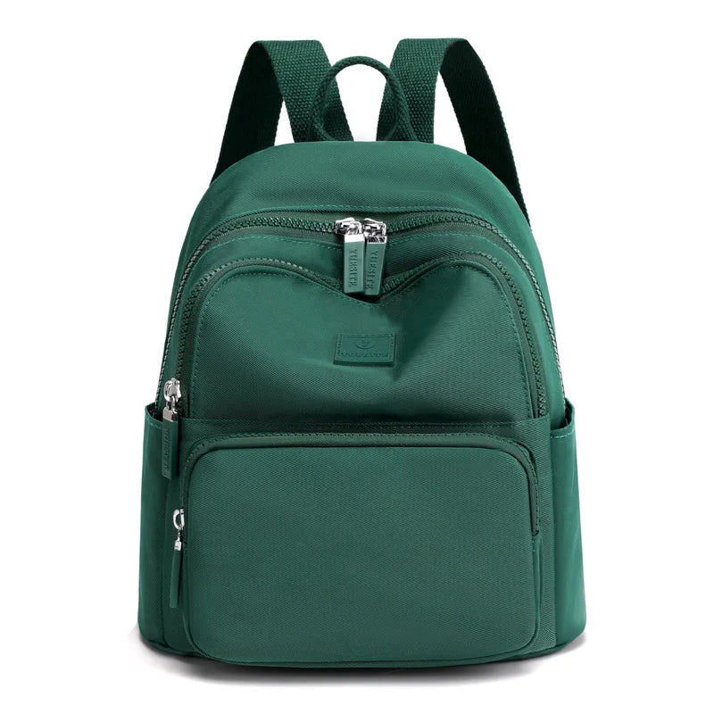 Green backpack on a white background