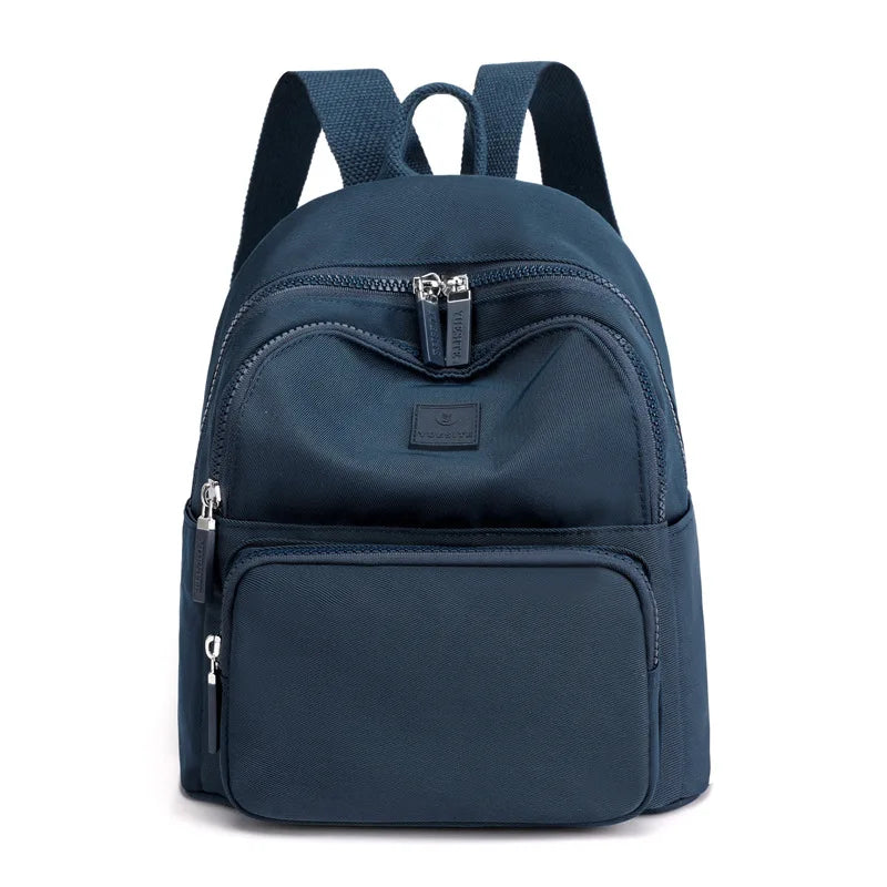 Navy blue backpack with zippers on a white background