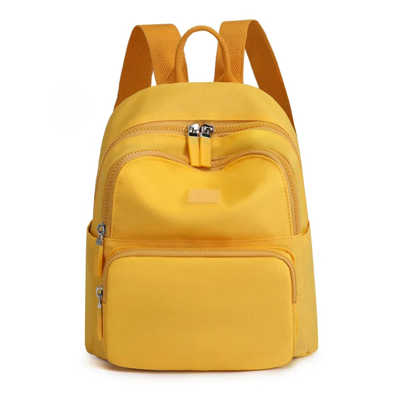 Yellow backpack on a white background