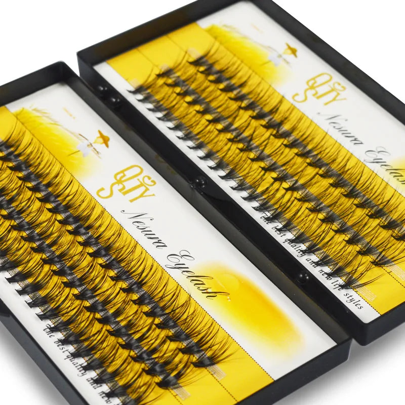 Set of false eyelashes in a black and yellow packaging box on a white background