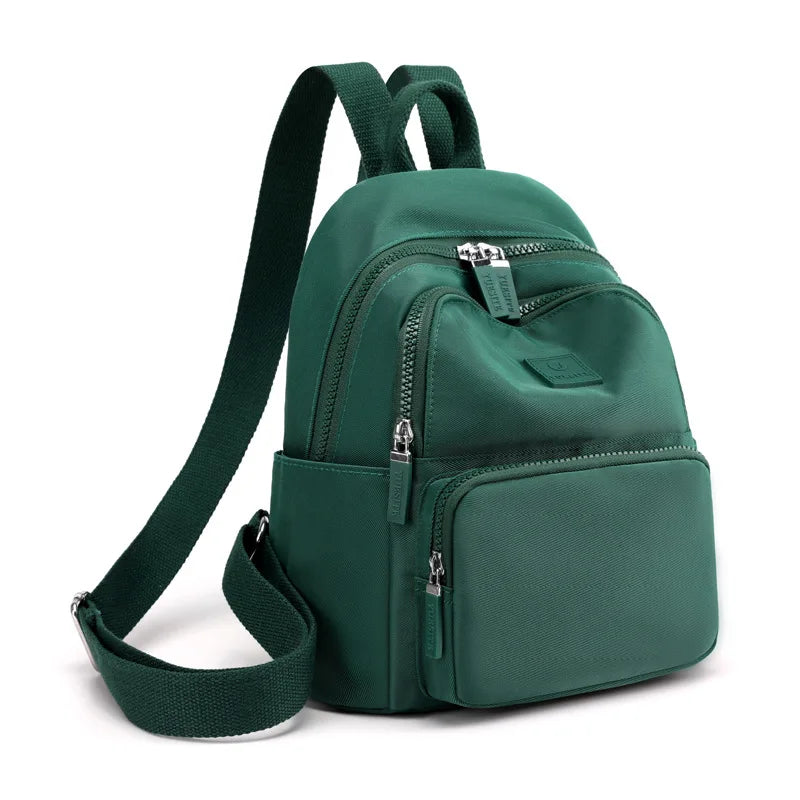 Green backpack on a white background