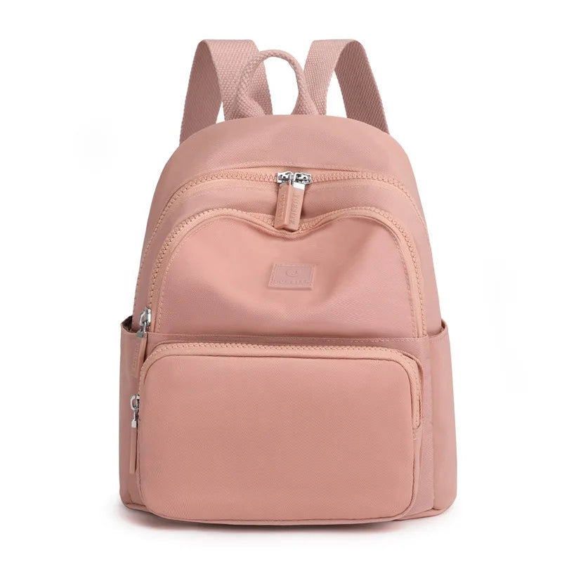 Pink backpack on a white background