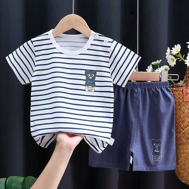 Children's striped shirt and shorts set with owl design on a dark background