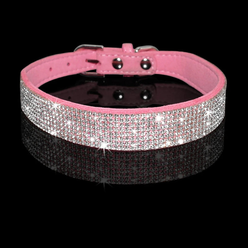Pink dog collar with rhinestones on a black background