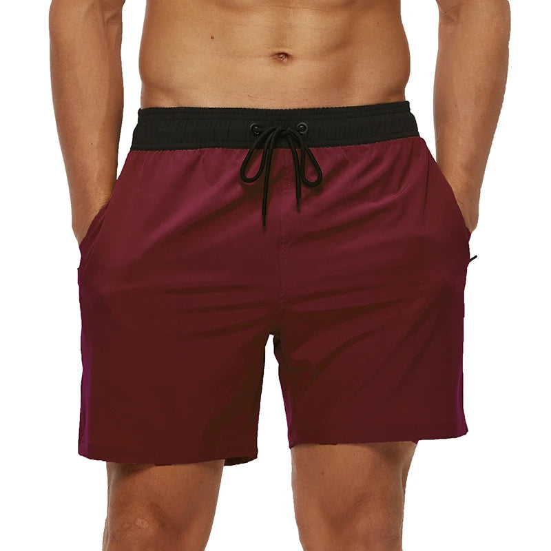 Maroon swim shorts with a black waistband on a white background