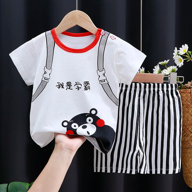 Children's outfit with white shirt, suspenders, and black and white striped shorts on a hanger.