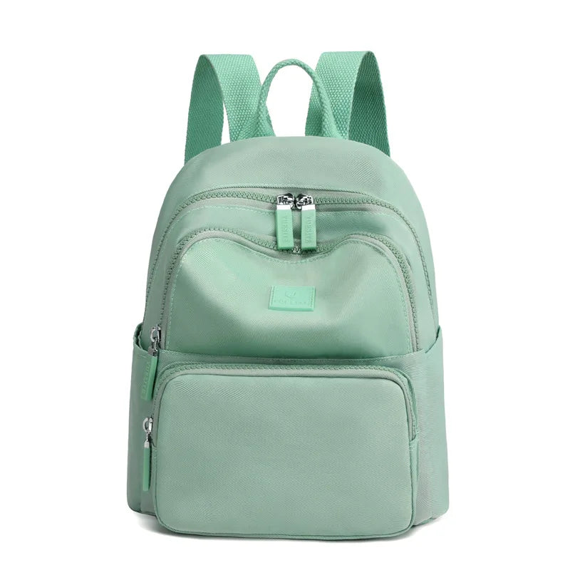 Mint green backpack on a white background