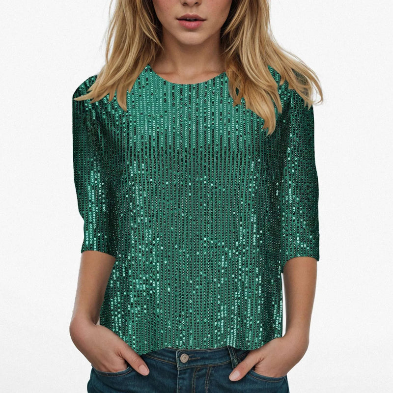 Green sequin top worn by a person on a white background