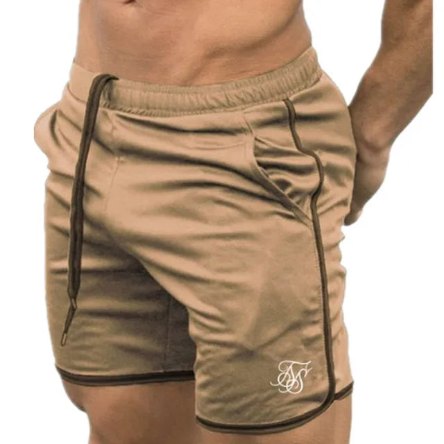 Beige shorts with a brand logo on a white background