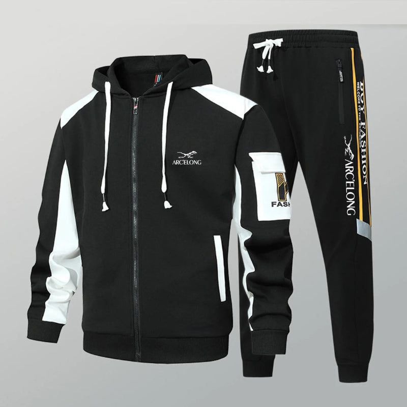 Black and white tracksuit with brand logo on a gray background