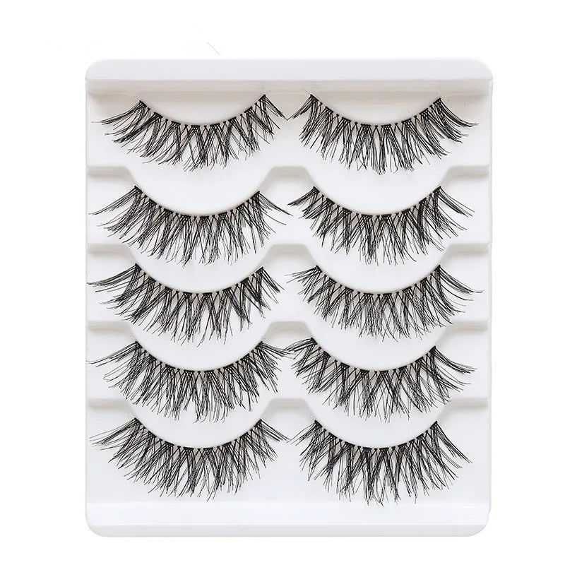 Set of false eyelashes in a white display case on a white background