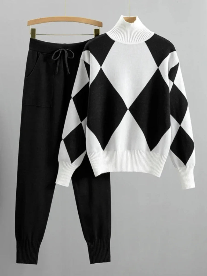 Black and white checkered sweater and pants set on a gray background