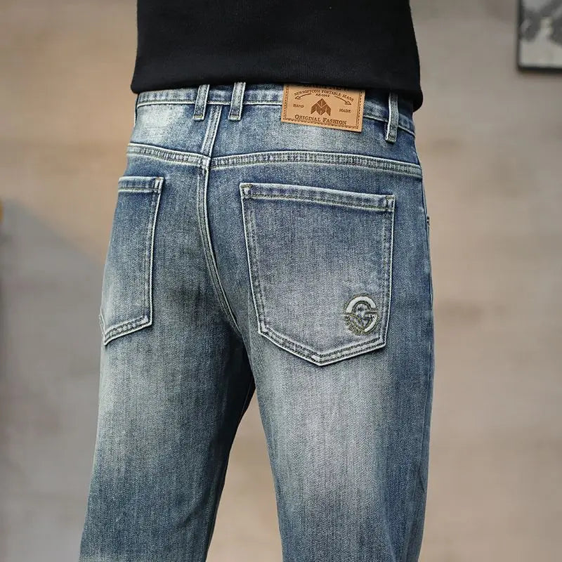 Blue jeans with a brand patch on a blurred background