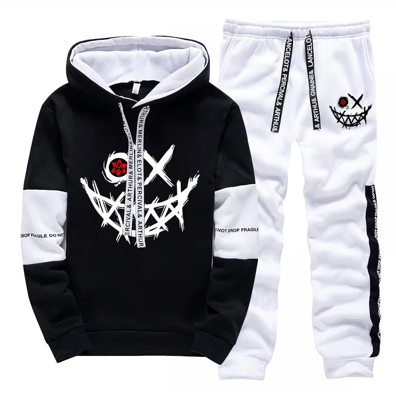Black and white hoodie and pants set with graphic designs on a white background