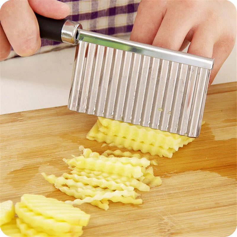 Stainless steel wavy potato cutter and French fry chopper kitchen tool for making crisp, uniform fries easily. use