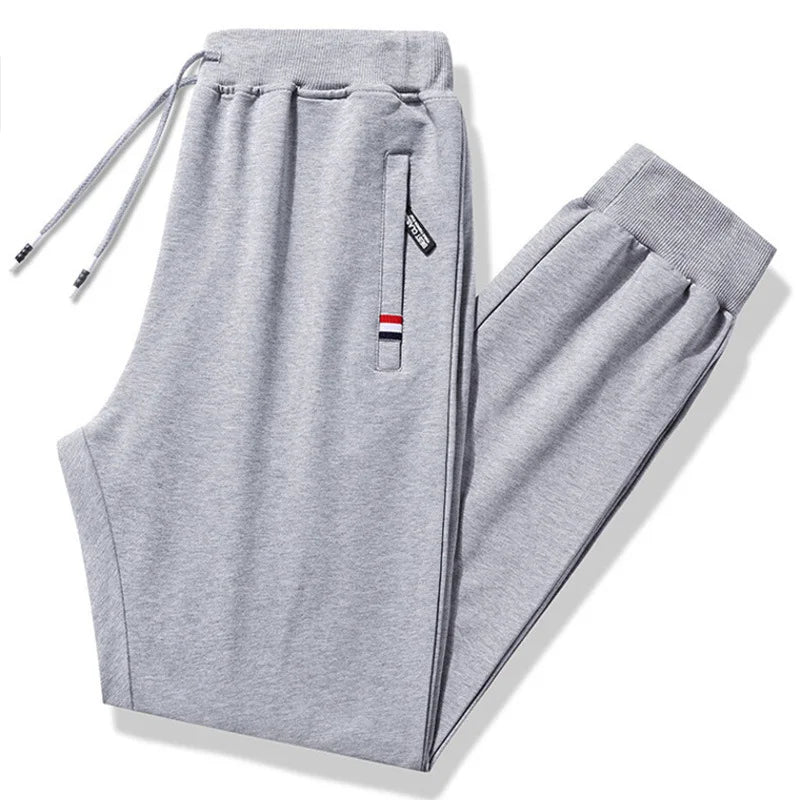 Gray sweatpants with a small logo on a white background