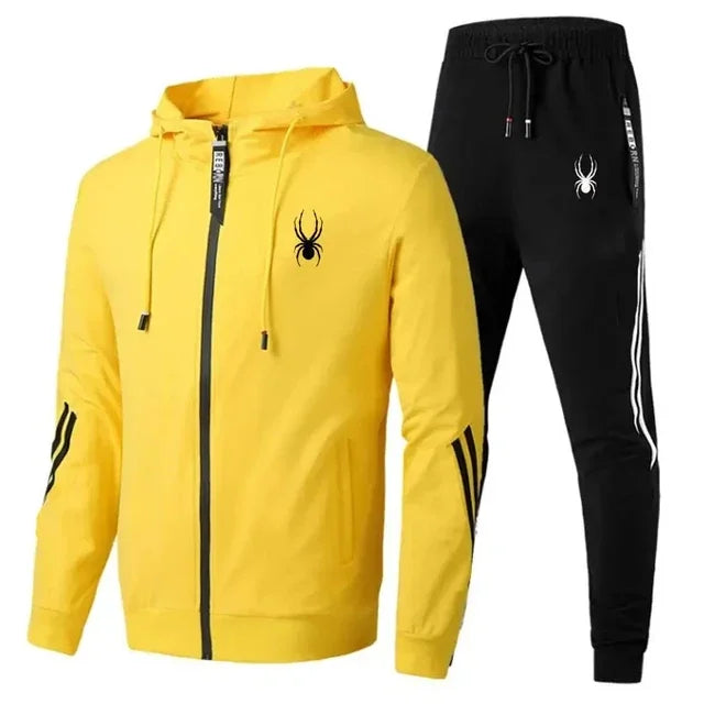 Yellow hoodie and black pants with a spider logo on a white background