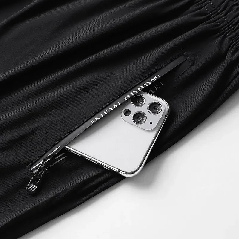 Phone case with zipper pocket on a black fabric background