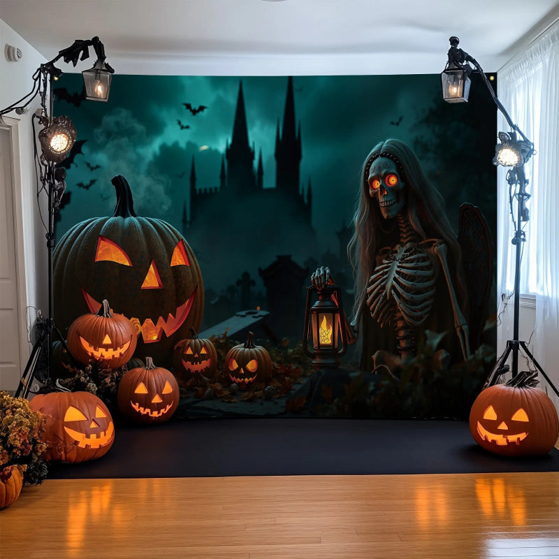 Halloween-themed setup with pumpkins and a skeleton in front of a dark castle backdrop.