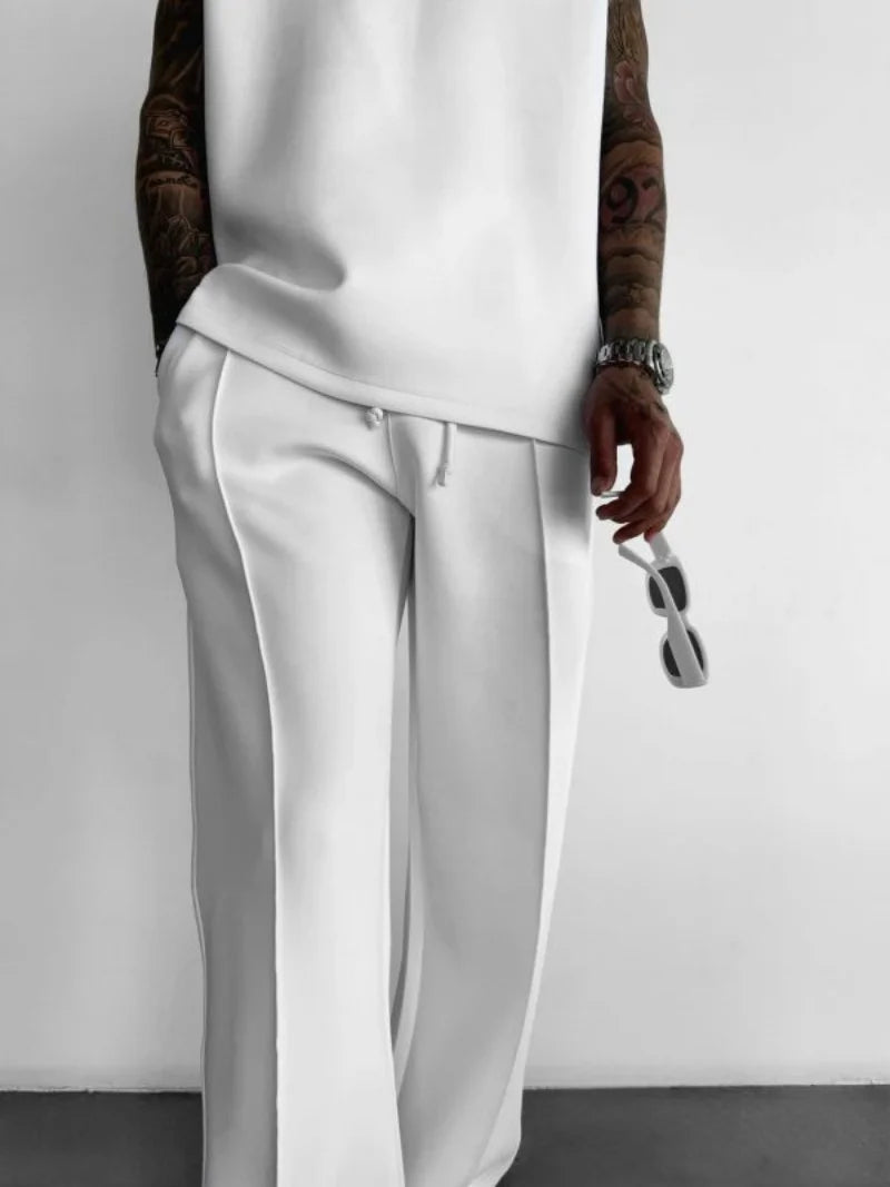 Men’s casual solid-color pants with elastic waist, drawstring closure, and side pockets white
