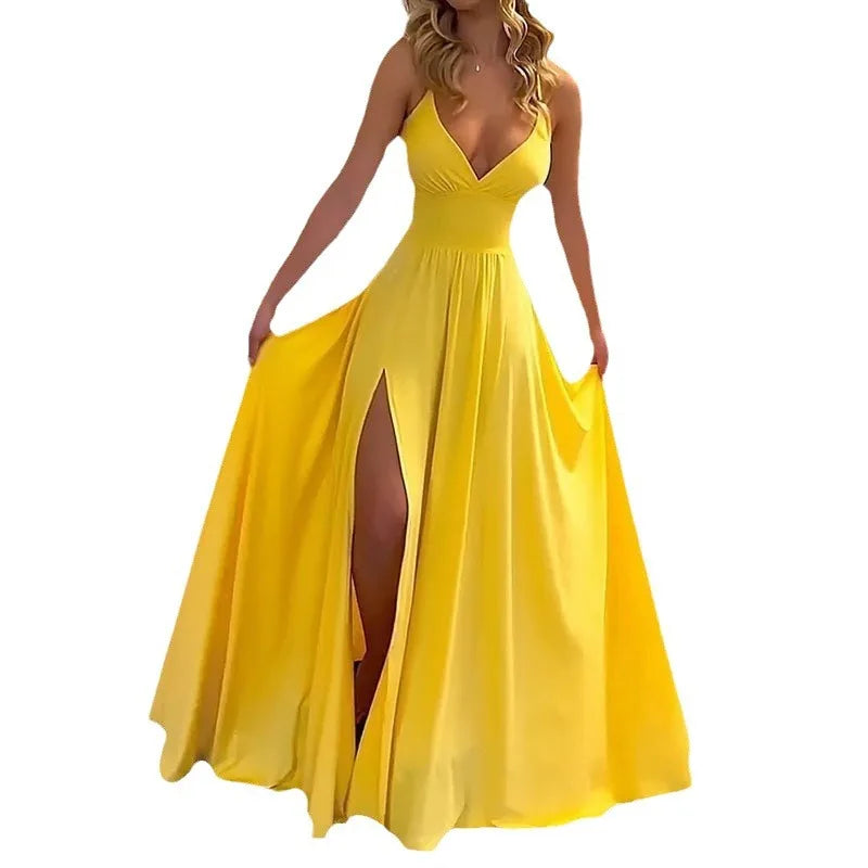 Yellow evening gown with a high slit on a white background