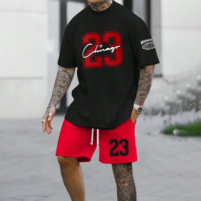 A man wearing a two-piece summer suit with a short-sleeve t-shirt and matching shorts, both featuring a bold 'Chicago' 3D print design in black and white.