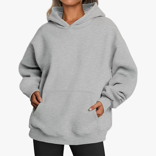 Gray hoodie worn by a person on a white background