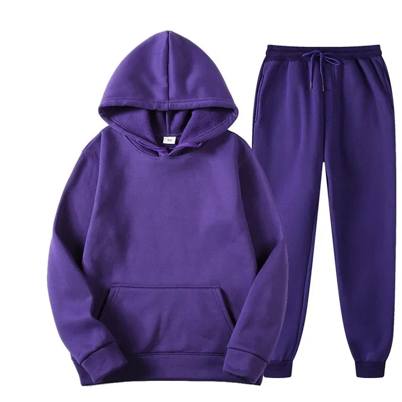 Purple hoodie and pants set on a white background