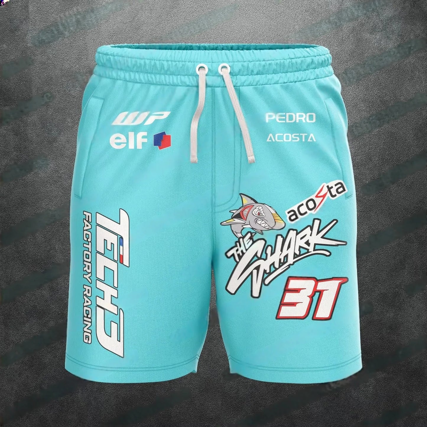 Turquoise shorts with racing-themed graphics and branding on a dark background