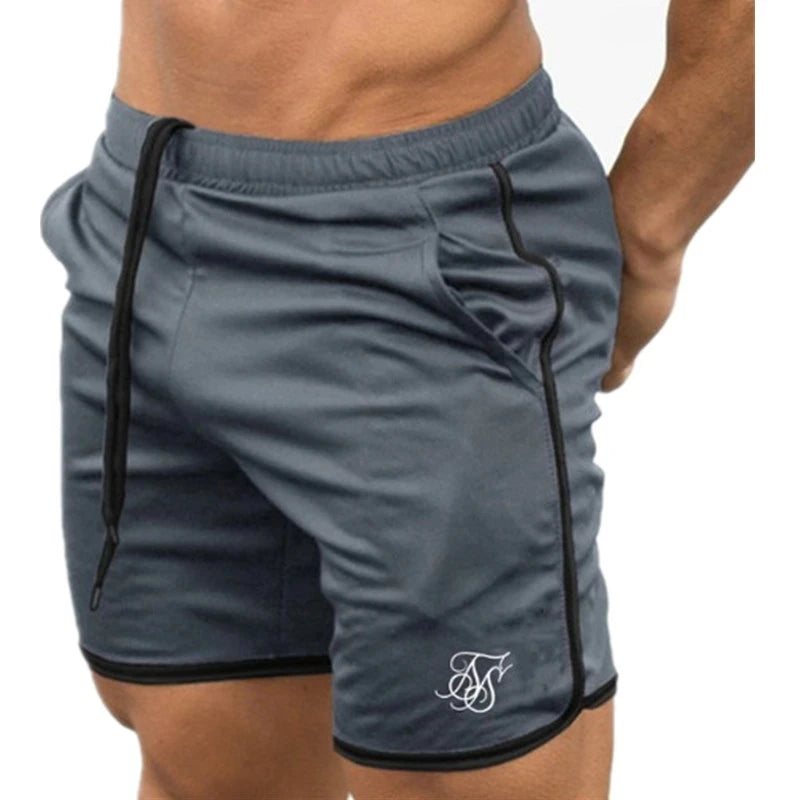 Gray athletic shorts with a logo on a white background