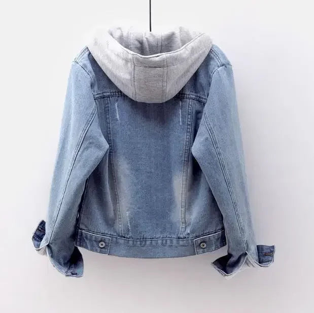 Blue denim jacket with a gray hoodie on a white background