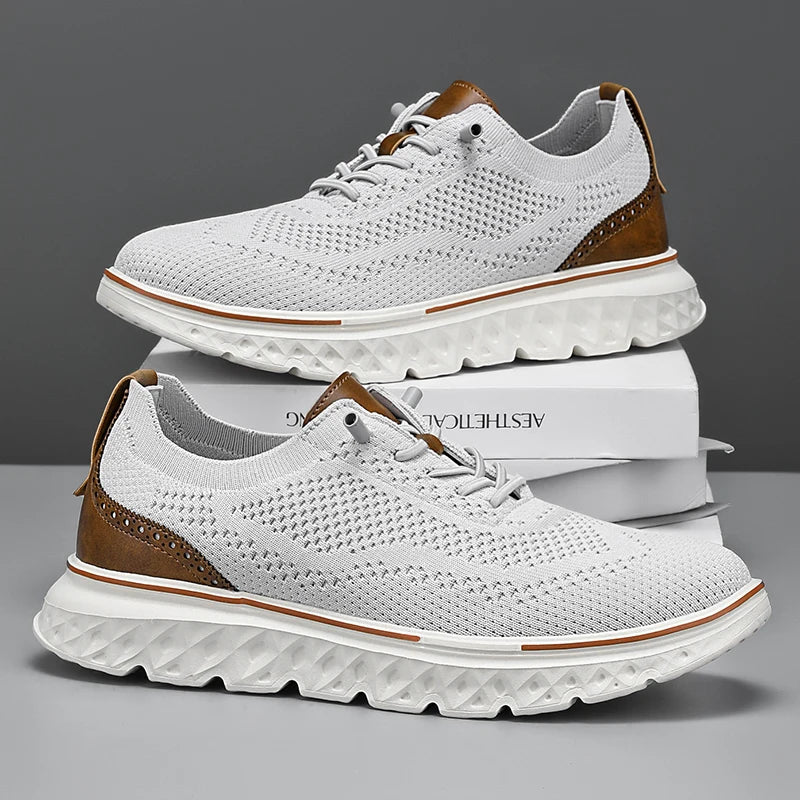 White sneakers with brown accents on a reflective surface with a gray background
