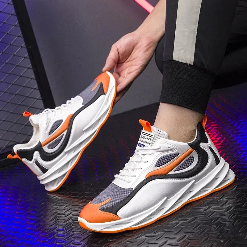Person wearing white sneakers with orange and black accents on a dark textured surface.