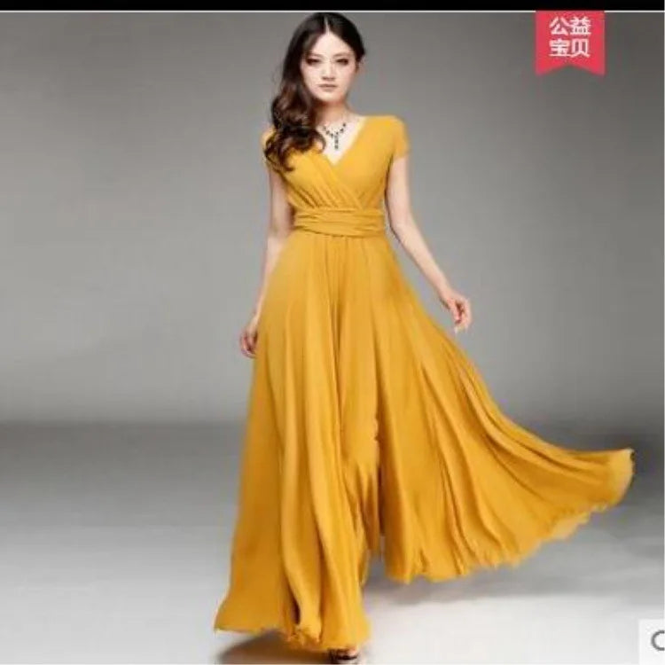 Woman wearing a yellow dress on a gray background