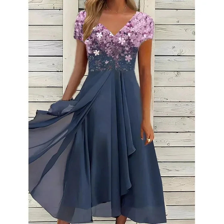 Blue and purple dress with floral top on a wooden background