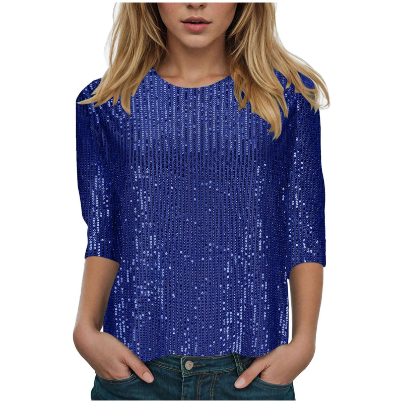 Blue sequin top worn by a person on a white background