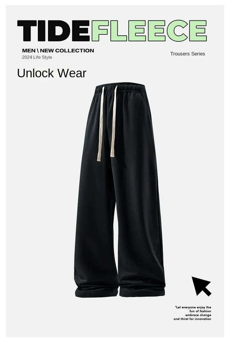 Black fleece pants with white drawstring on a white background, featuring Tide Fleece branding.