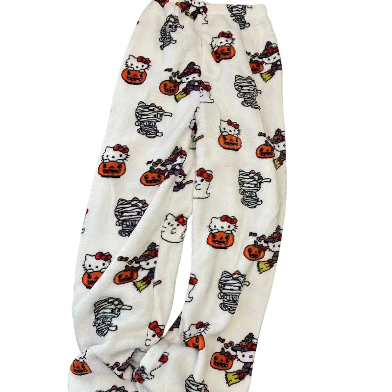 Halloween-themed pajama pants with cartoon characters on a white background