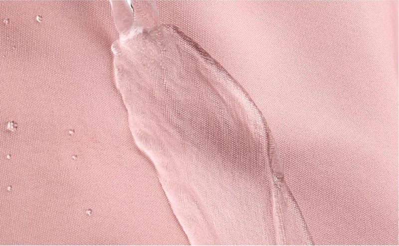 Close-up of a pink textured surface with a white smear