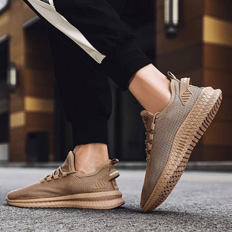 Brown sneakers worn with black pants on a blurred background