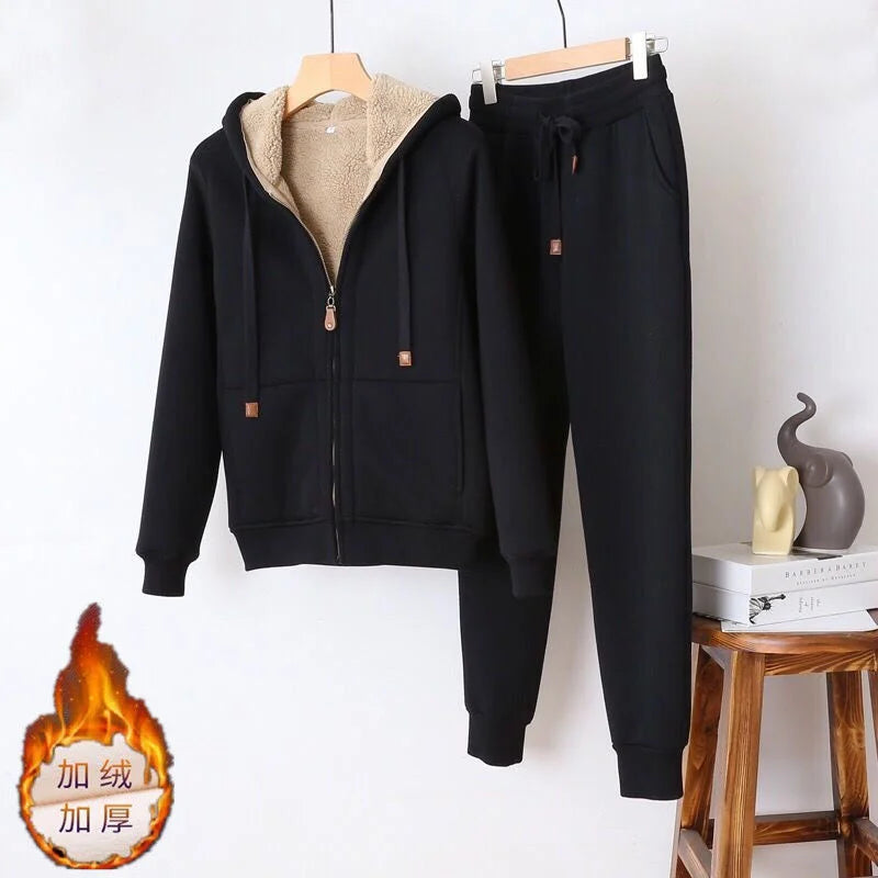 Black tracksuit with beige lining on a white background