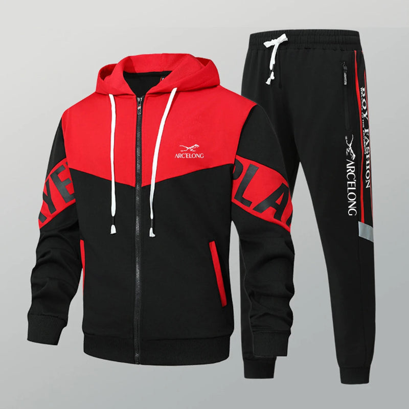 Red and black tracksuit with visible branding on a gray background