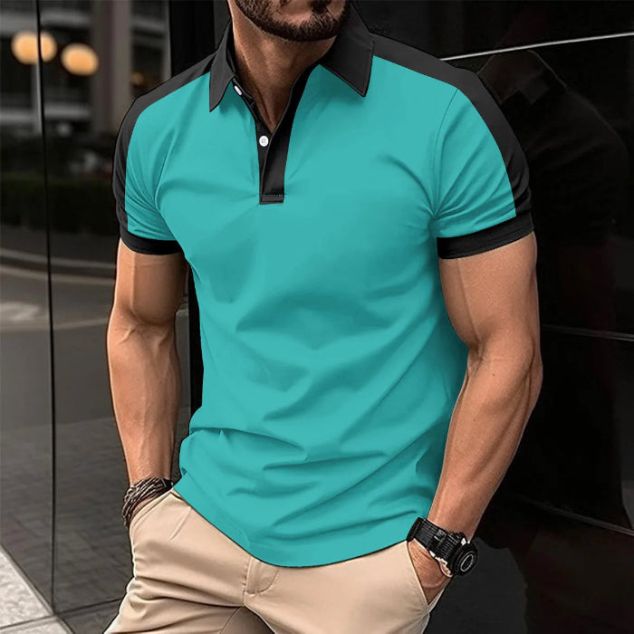A man wearing a red and black patchwork polo shirt with short sleeves and a collar.