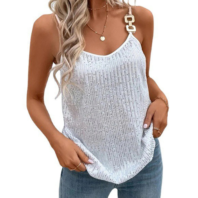 Woman wearing a light blue sequin tank top and jeans on a white background