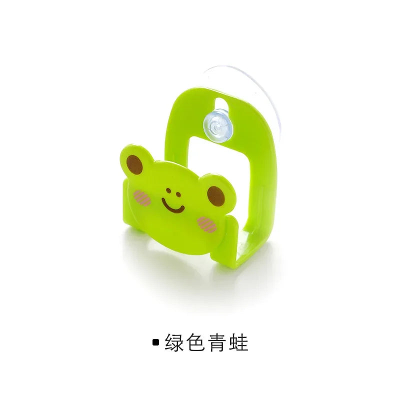 Green frog-shaped product on a white background