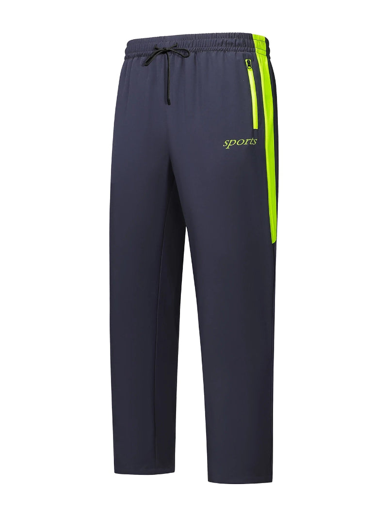 Navy blue sports pants with a green stripe and 'sports' text on a white background