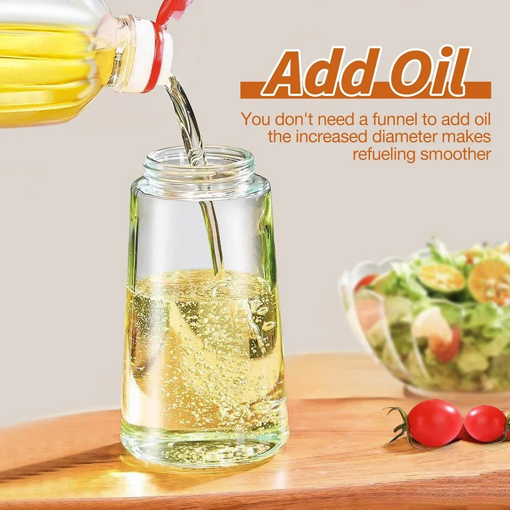 Oil being poured into a glass jar with a salad in the background